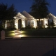 landscape lighting emphasizing the front of a house and the main walkway